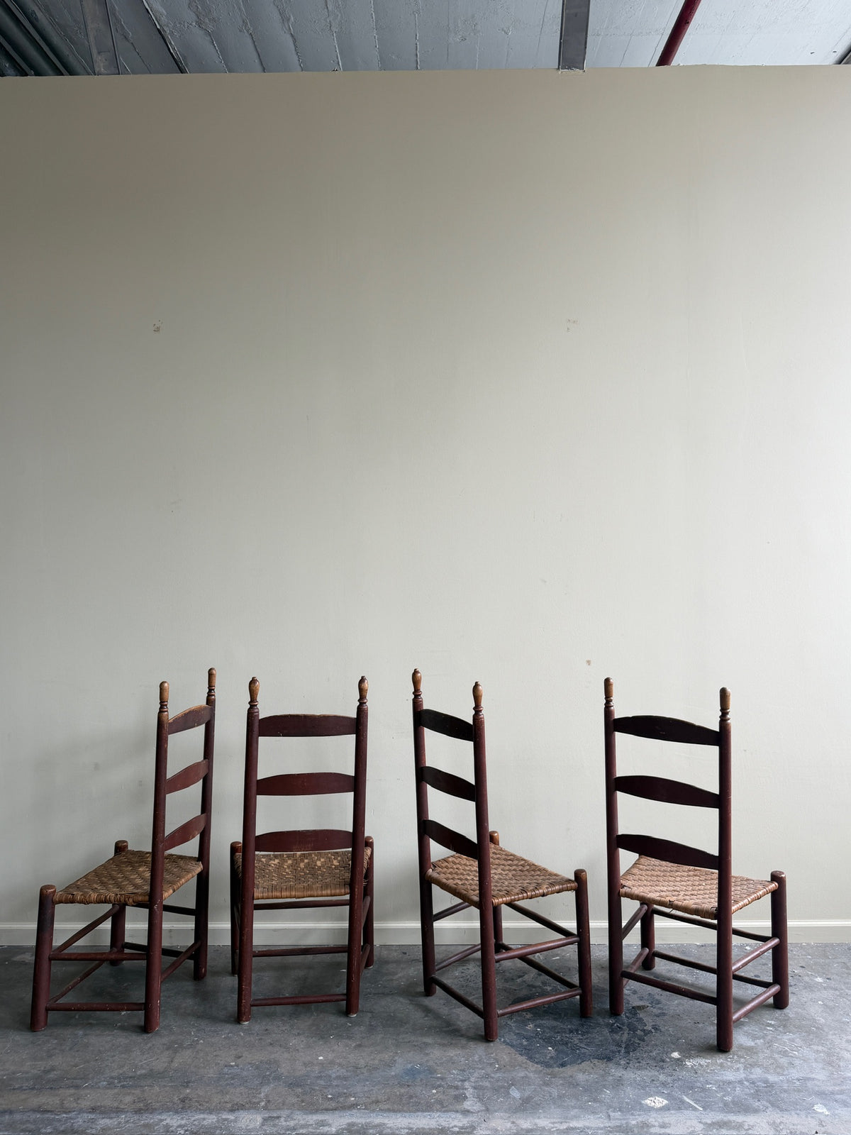 Pennsylvania painted maple ladder back chairs. Sold in pairs.