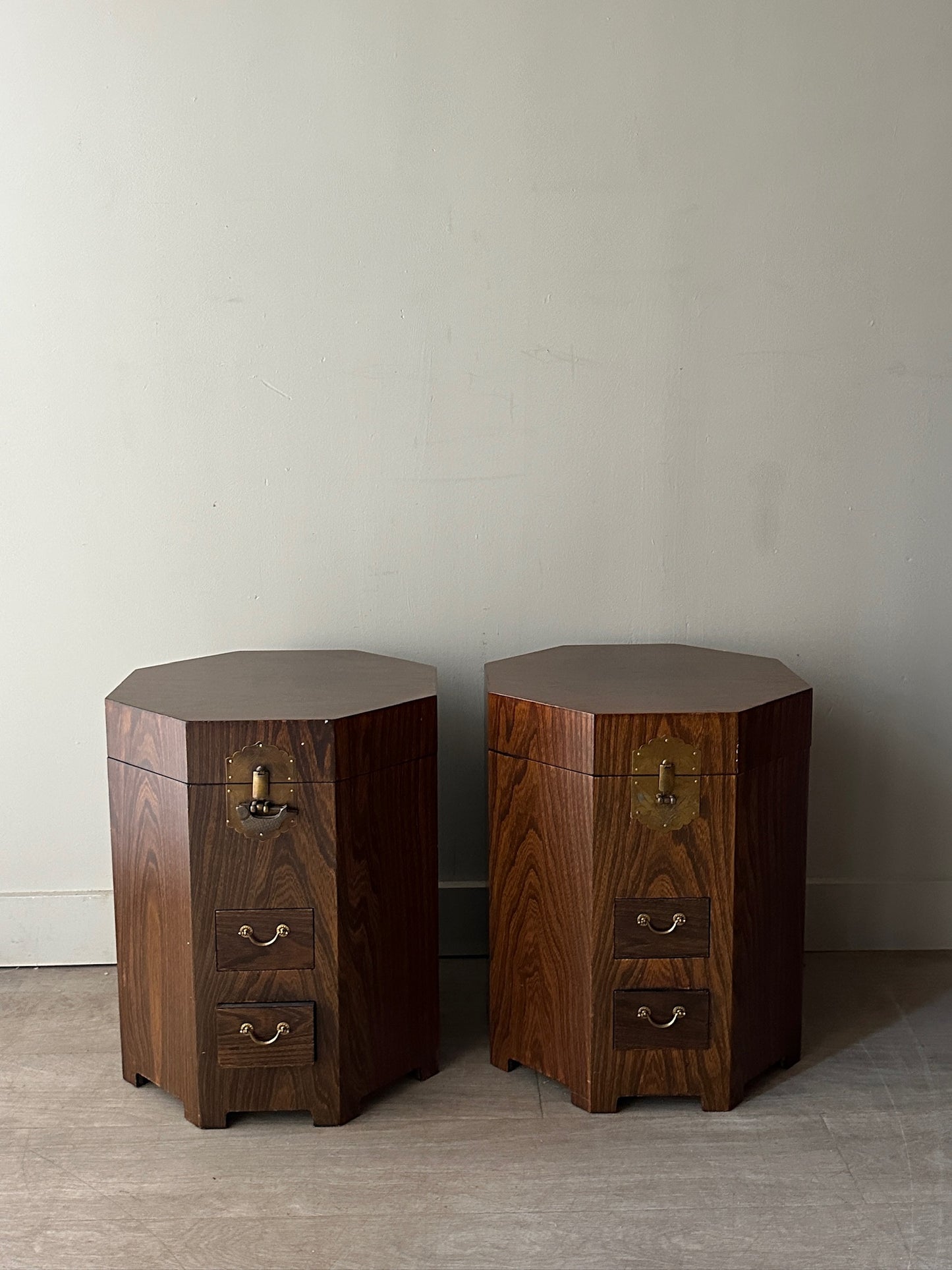 2 octagonal rosewood side tables. Sold individually.