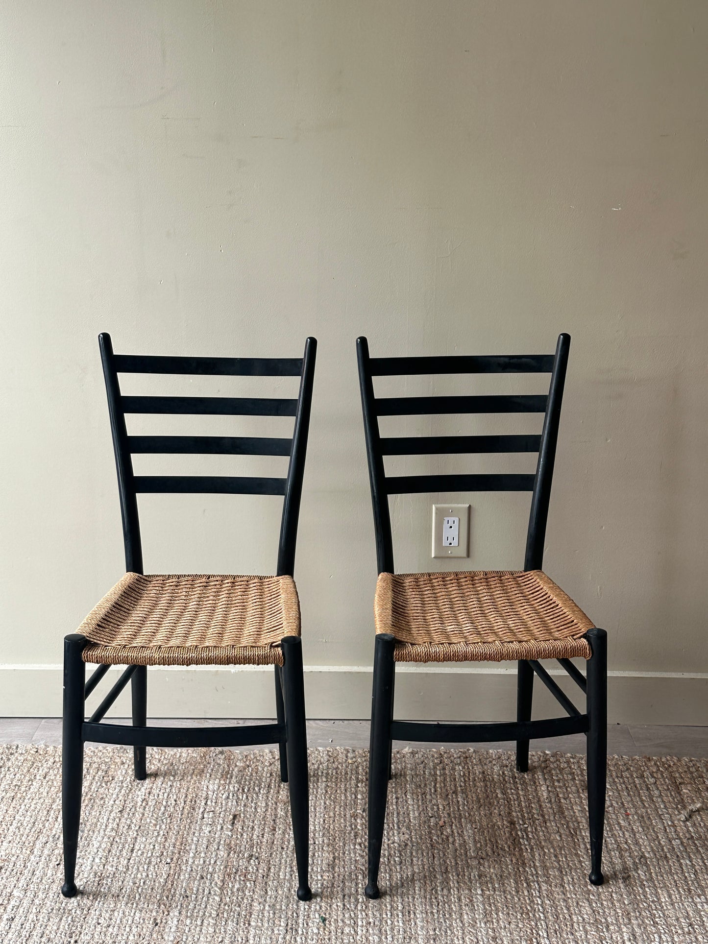Pair of woven dining chairs. Sold as pair.
