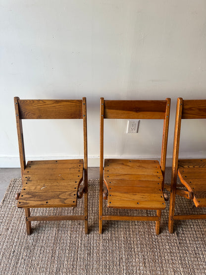 4 oak folding chairs. Sold individually.