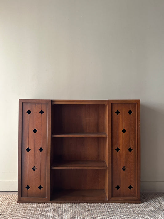 Walnut bookcase with cutouts