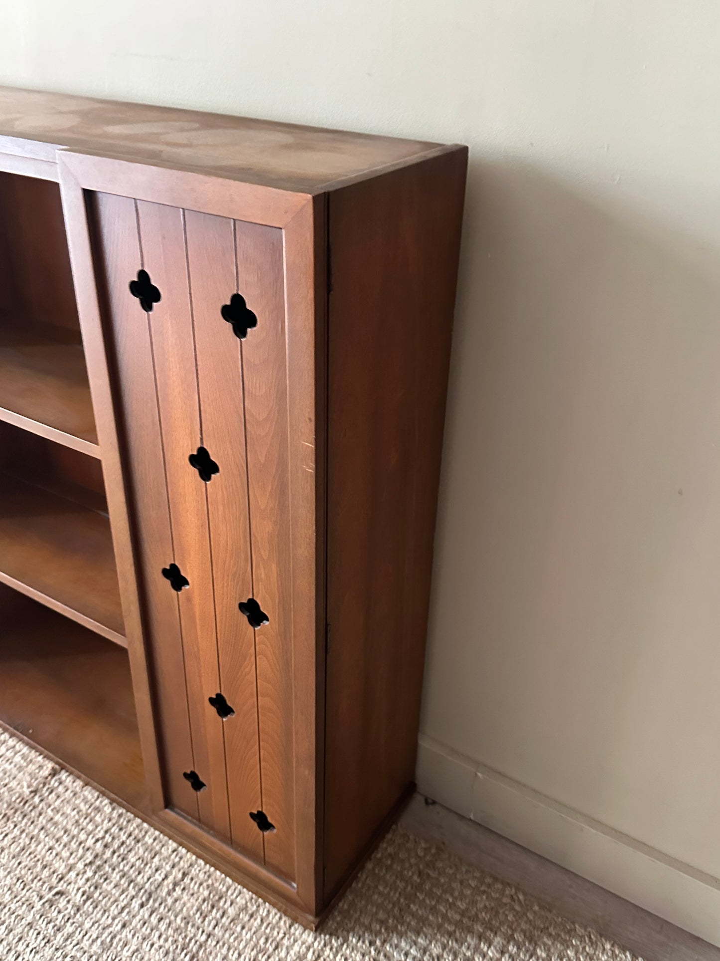 Walnut bookcase with cutouts