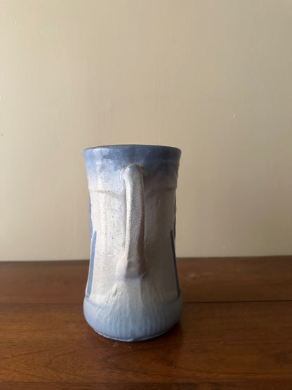 Salt glazed stoneware pitcher with flower