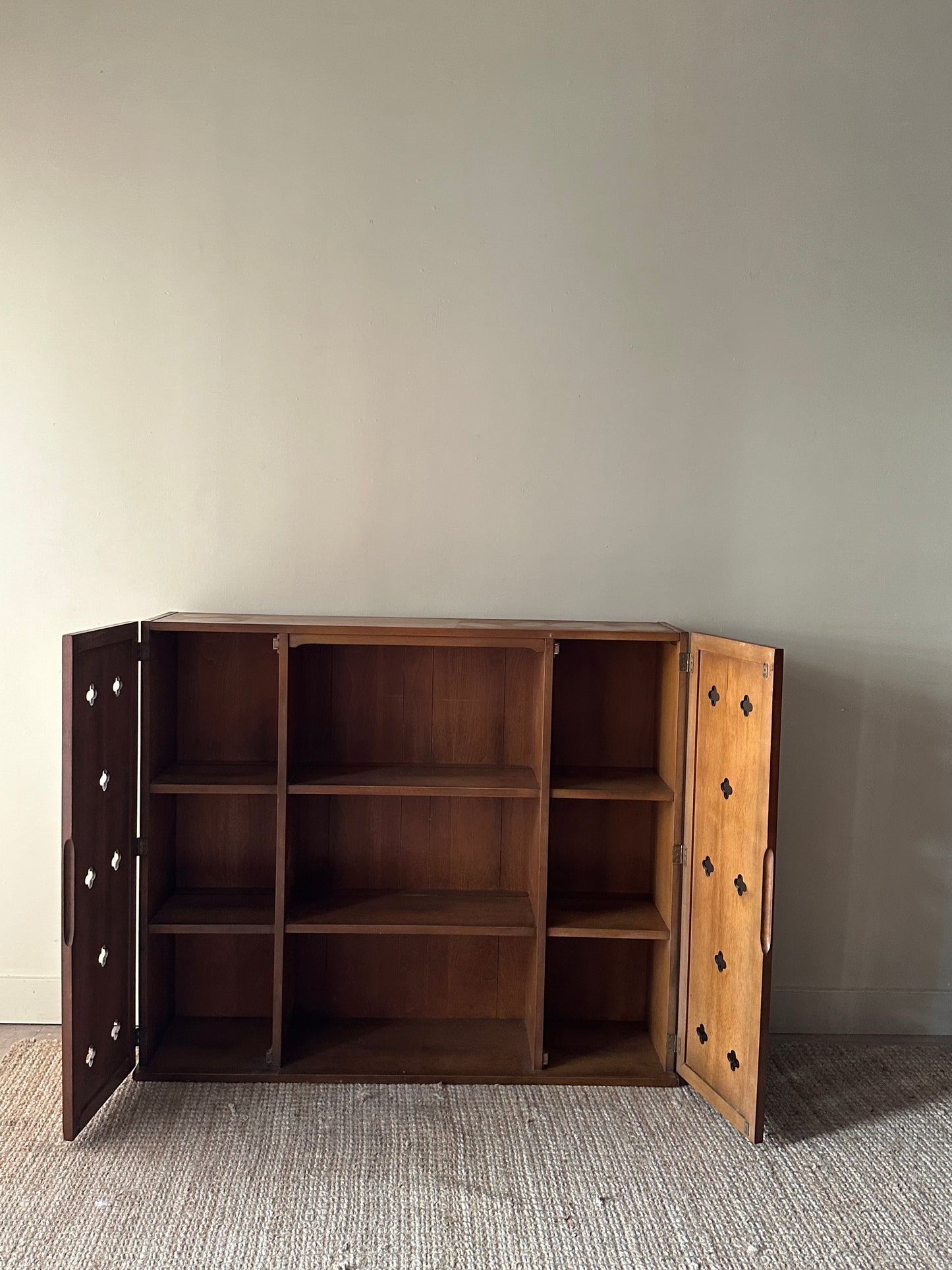 Walnut bookcase with cutouts