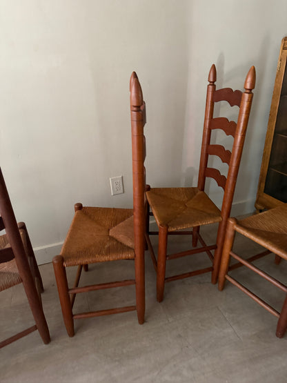Cherry ladder back rush seat dining chairs. Sold in pairs.