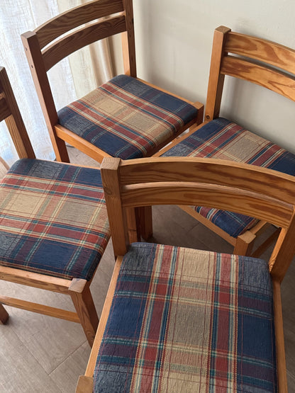 Danish pine plaid upholstered dining chairs. Sold in pairs.