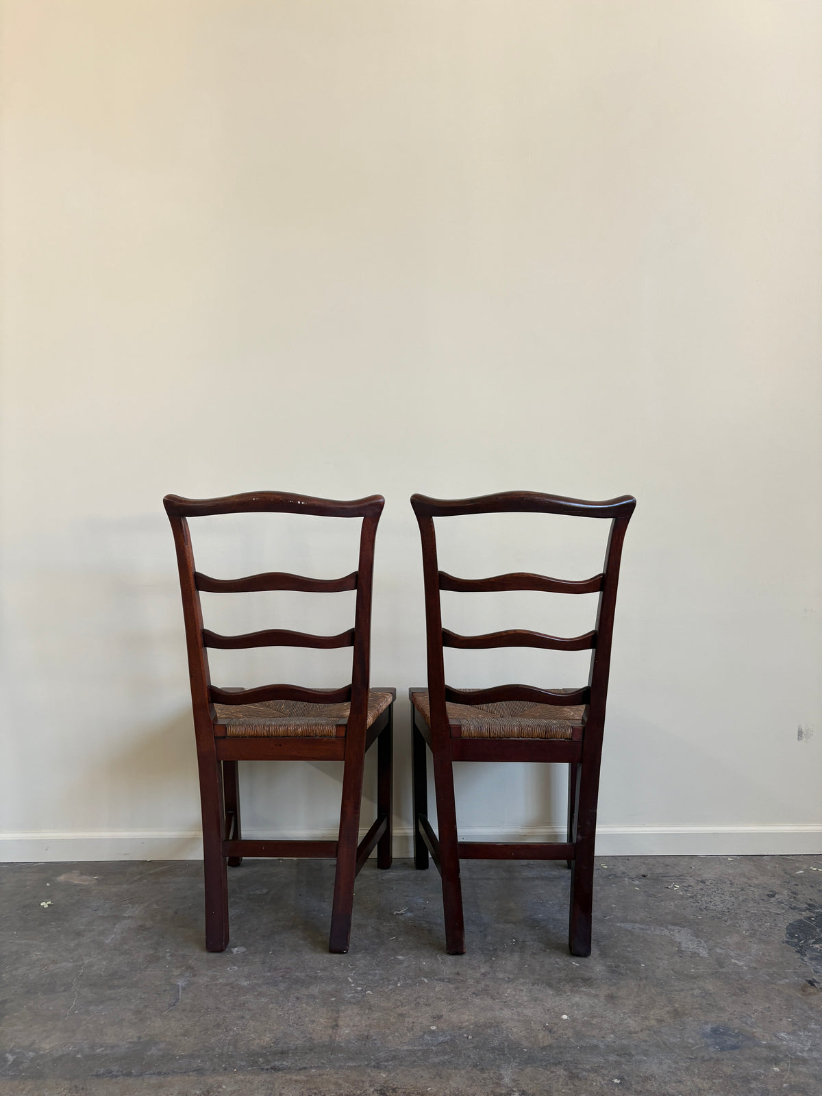 Flint & Horner mahogany rush seat dining chairs. Sold as a pair.