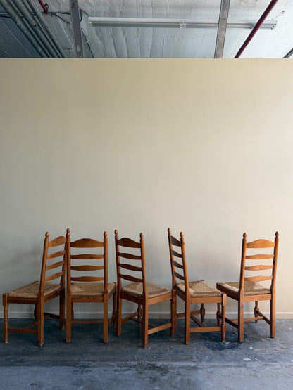 Dutch pine rush seat ladderback dining chairs. Sold individually.