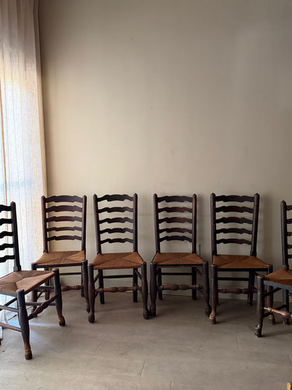 English provincial elmwood ladder back rush seat chairs. Sold in pairs.