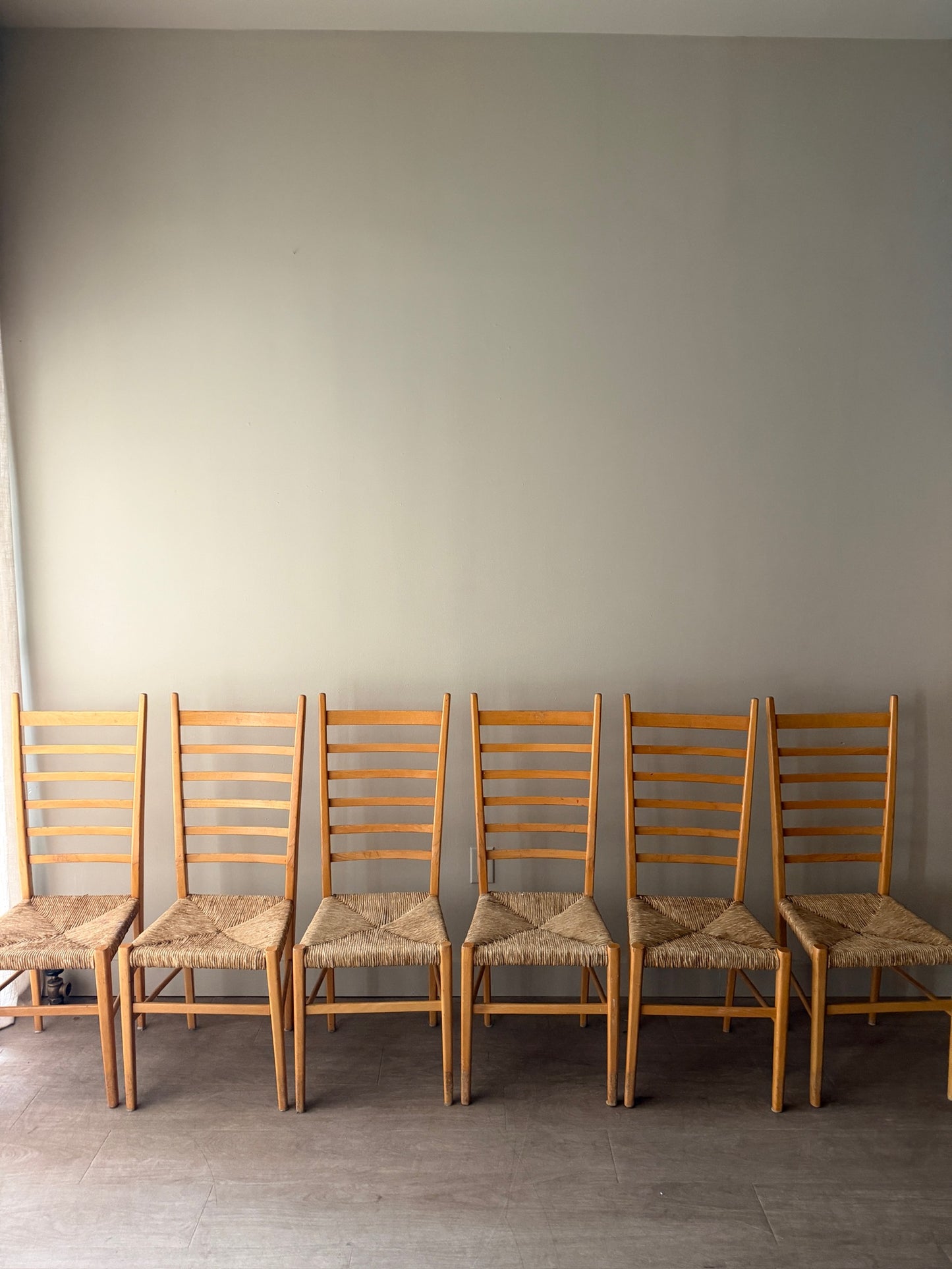 Maple ladder back dining chairs with rush seats. Sold in pairs.