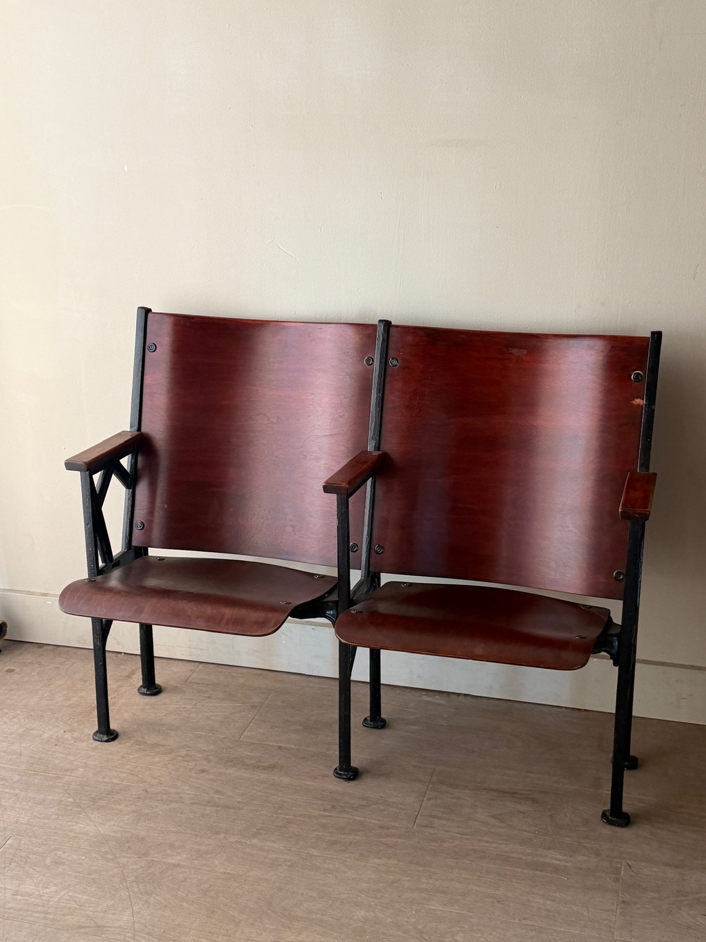 Cast iron and bentwood two-seat folding theater bench