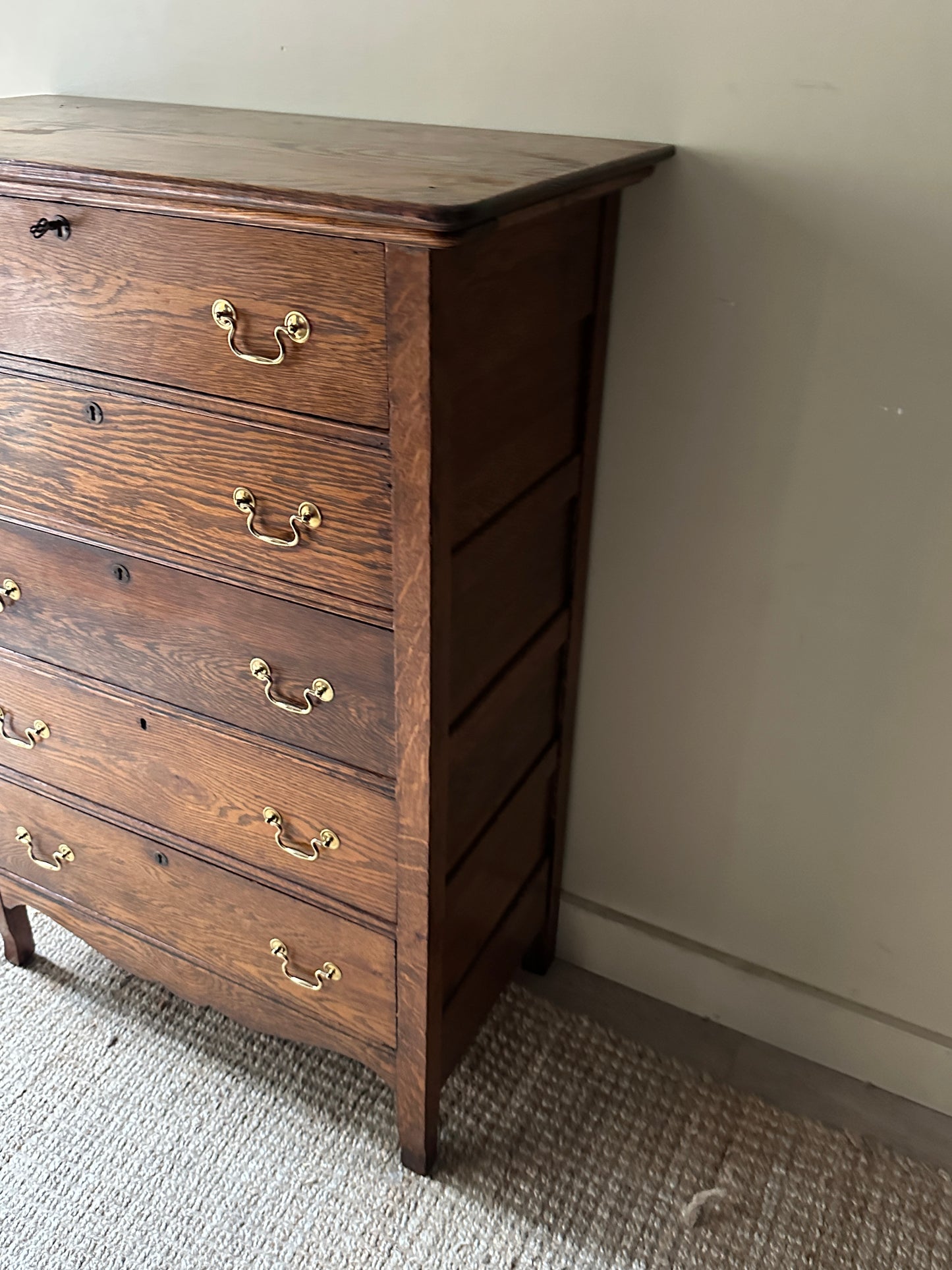 Oak tallboy with brass handles