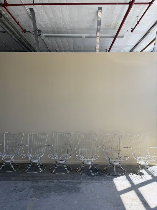White swivel patio chairs. Sold individually.