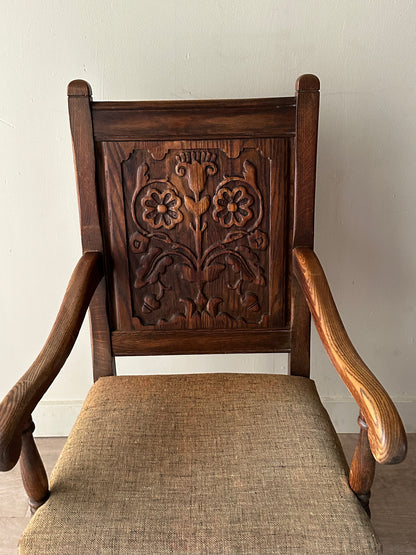 Carved oak upholstered armchair