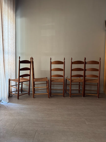 Cherry ladder back rush seat chairs. Sold individually.