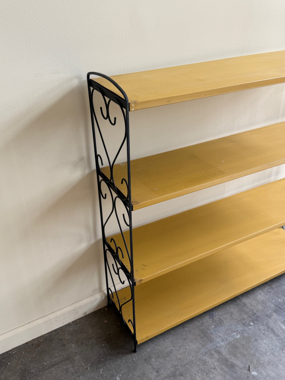 Yellow painted metal shelf