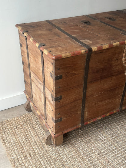 Large wooden chest on castors