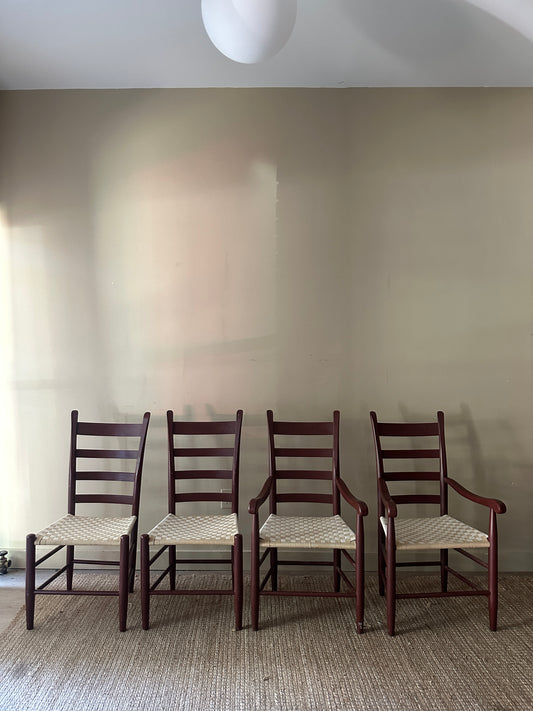 Armless woven chairs. Sold as a pair.
