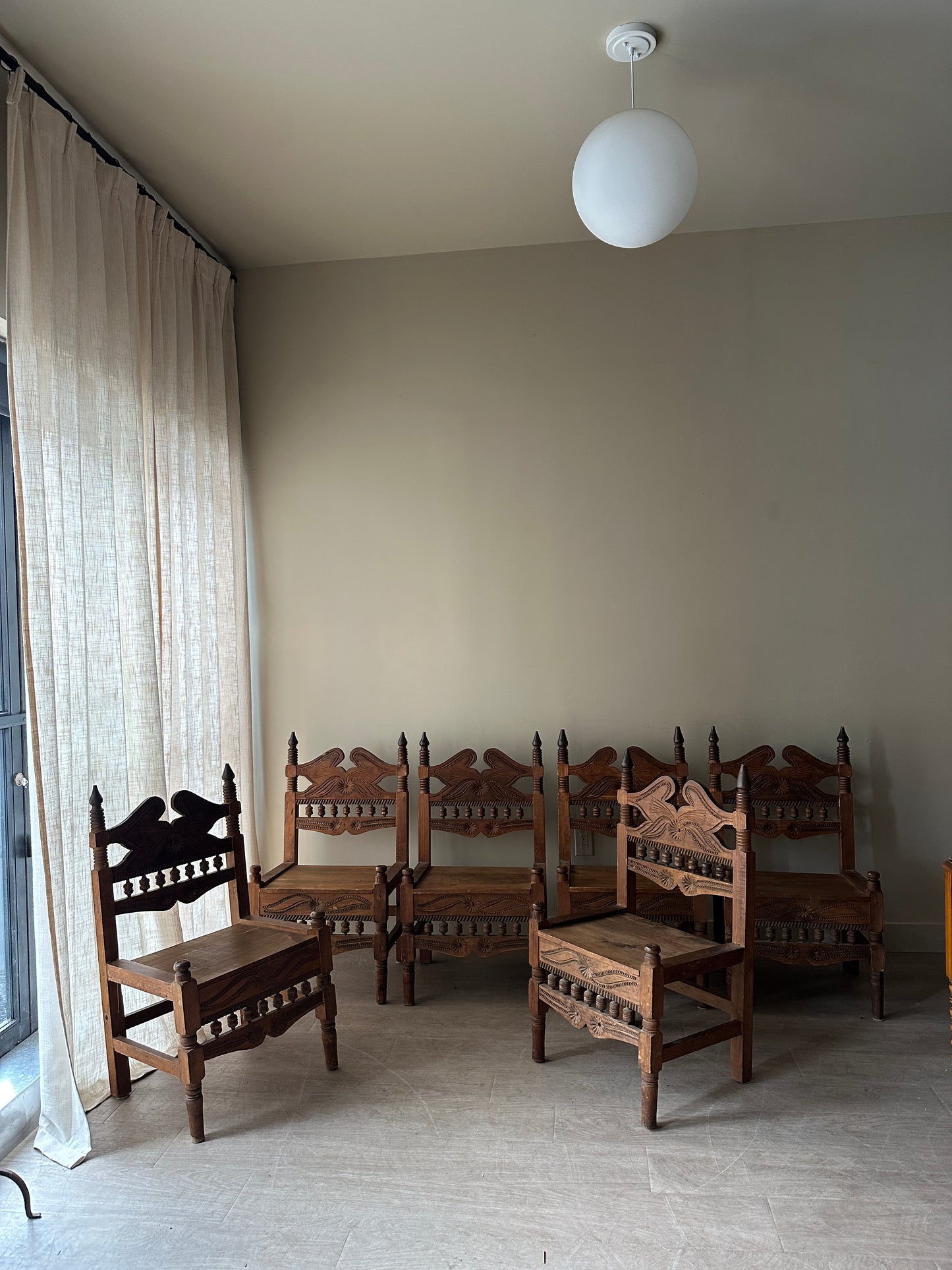6 hand carved chairs. Sold individually.