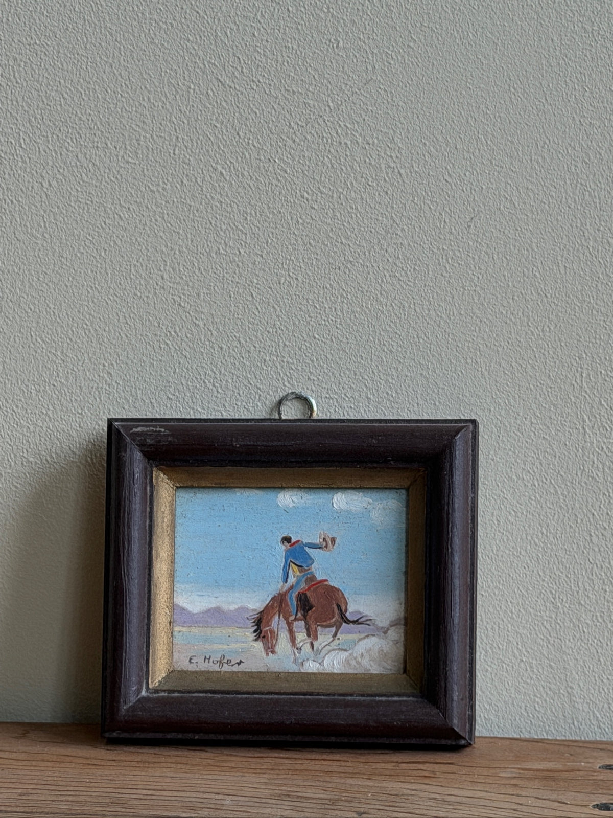 Small cowboy oil painting by E. Hofer