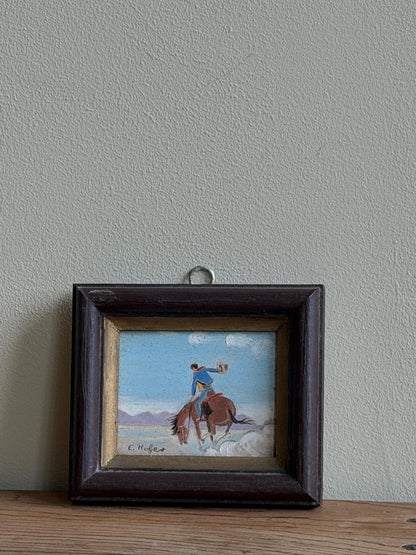 Small cowboy oil painting by E. Hofer