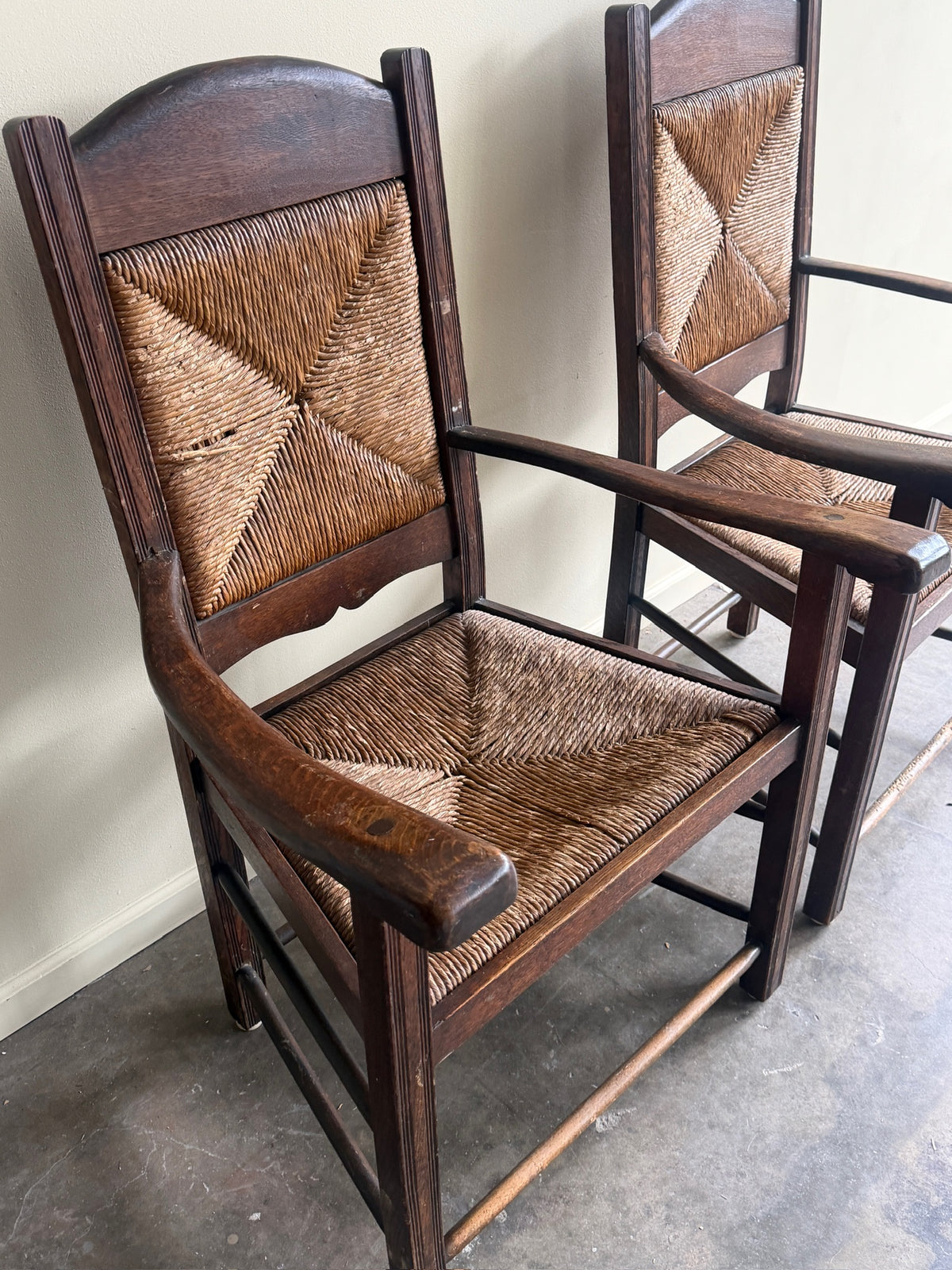 English provincial oak & rush armchairs. Sold individually.