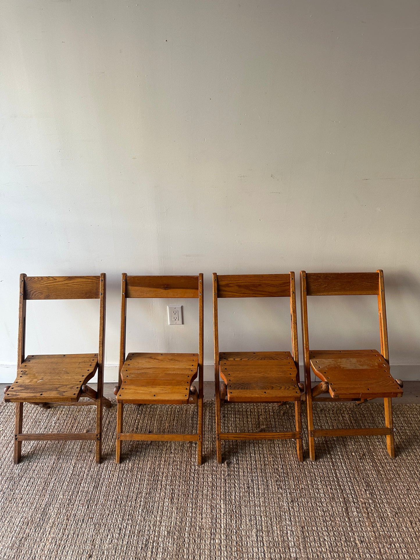 4 oak folding chairs. Sold individually.