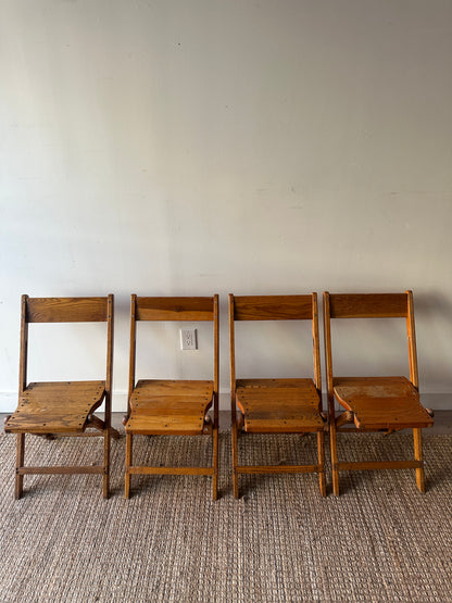 4 oak folding chairs. Sold individually.