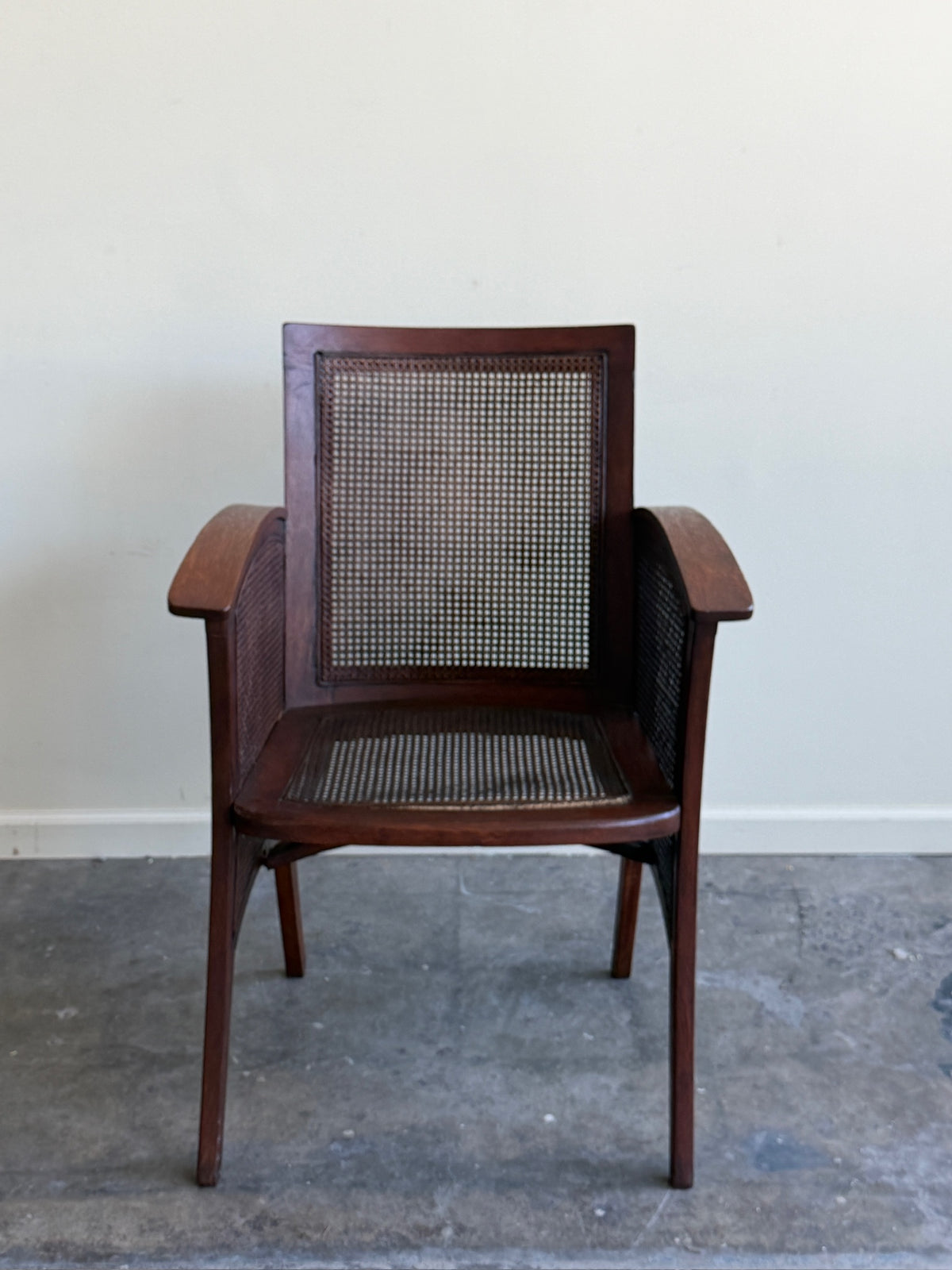 Golden oak caned armchair