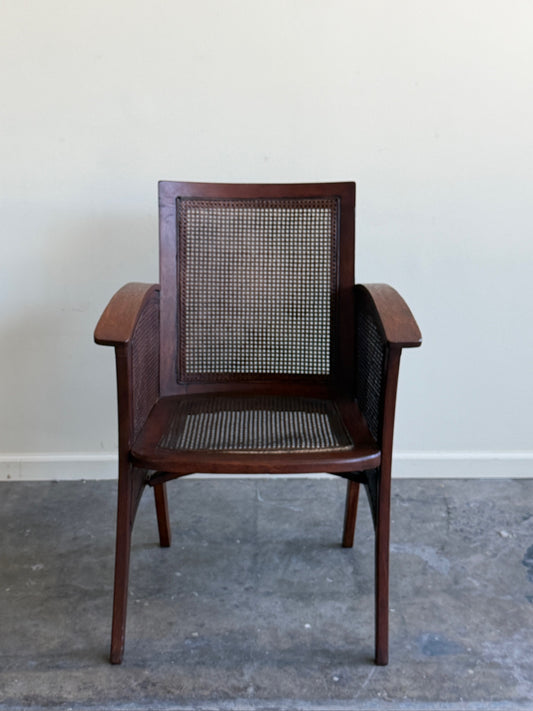 Golden oak caned armchair