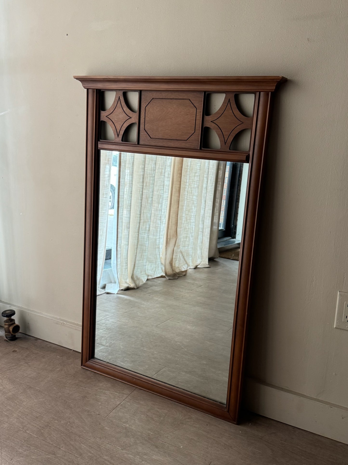 Carved walnut mirror