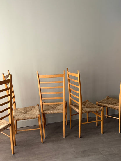 Maple ladder back dining chairs with rush seats. Sold in pairs.