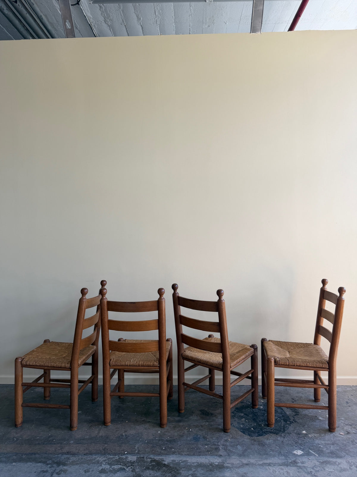French oak rush seat dining chairs. Sold as a set of 4.