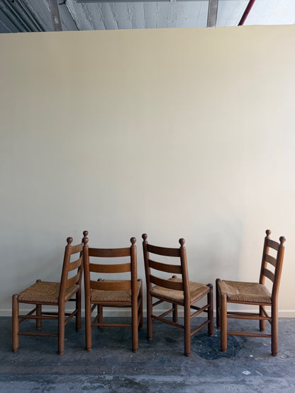 French oak rush seat dining chairs. Sold as a set of 4.