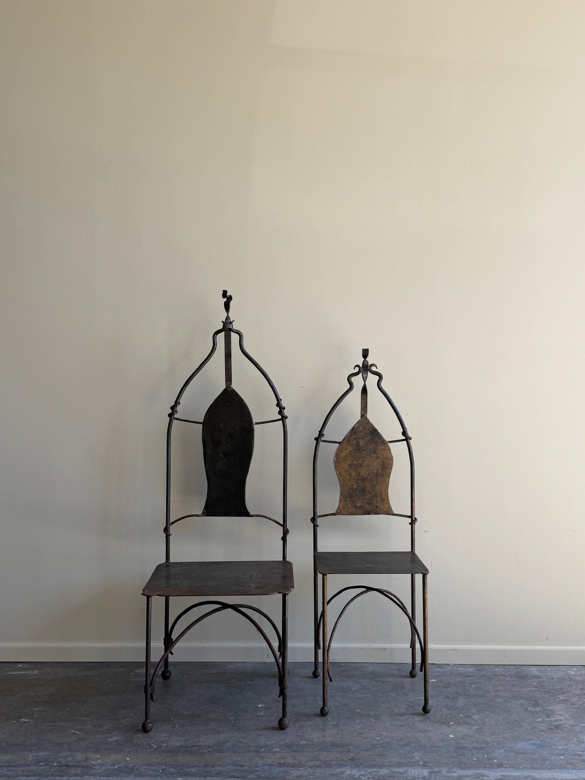 Wrought iron sculptural chairs (left)