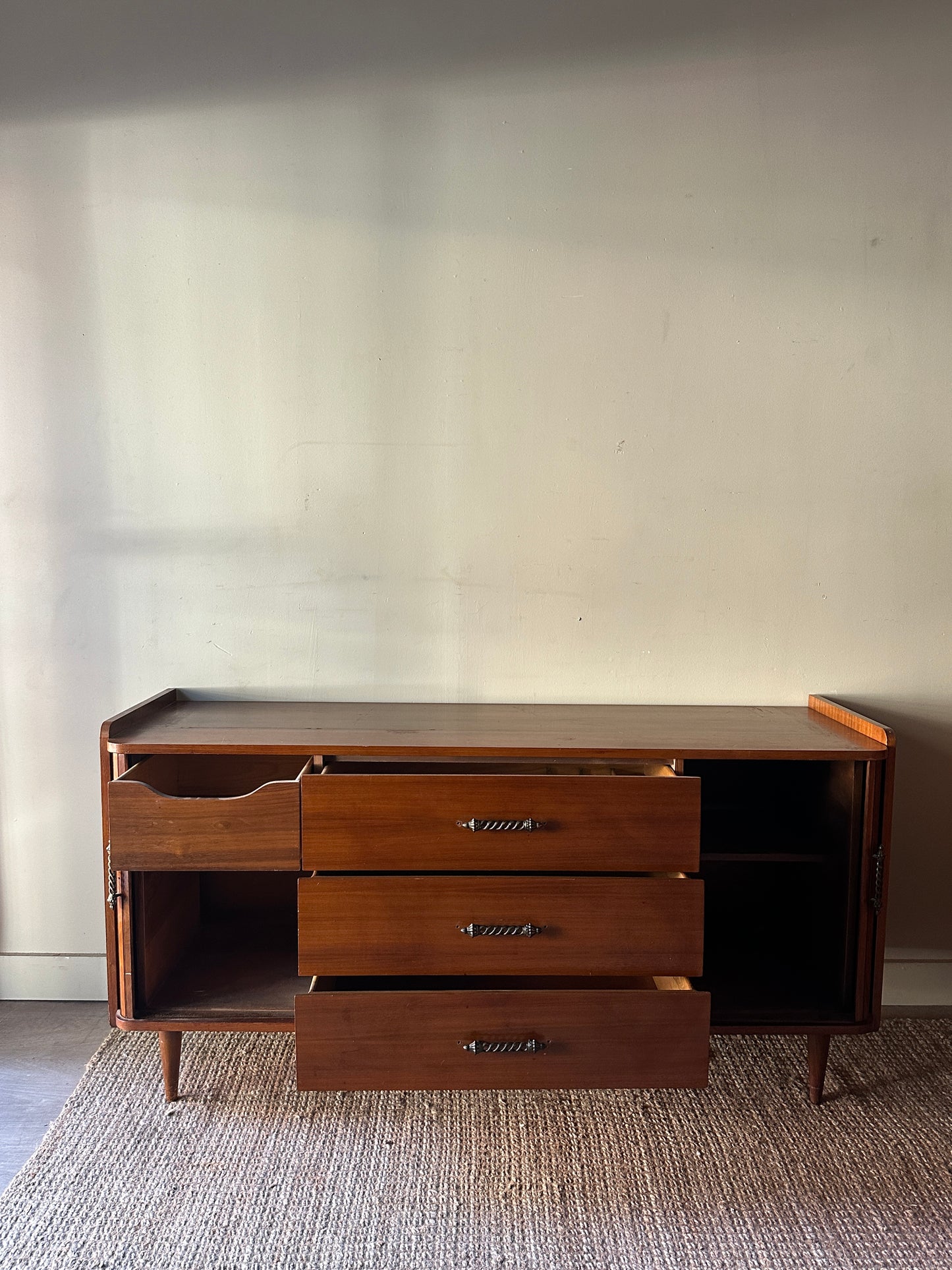 Accordion door credenza