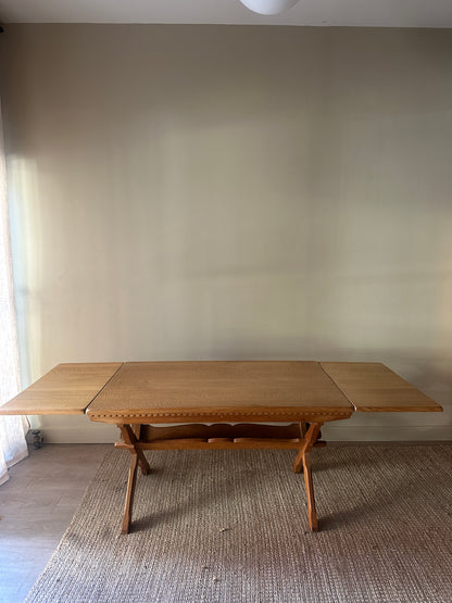 Danish oak dining table with removable leaves by Henning Kjaernulf