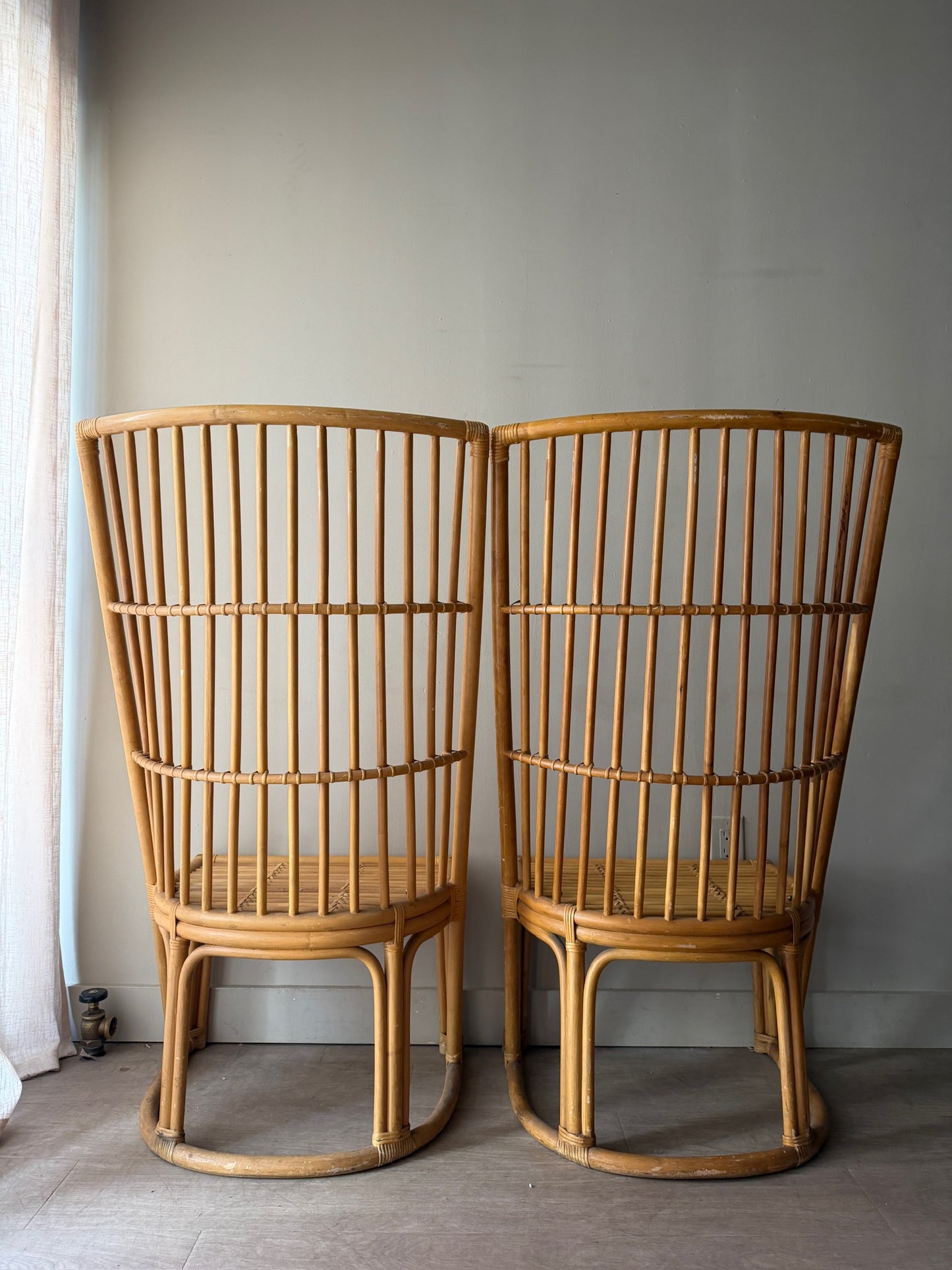 Rattan chairs. Sold individually.