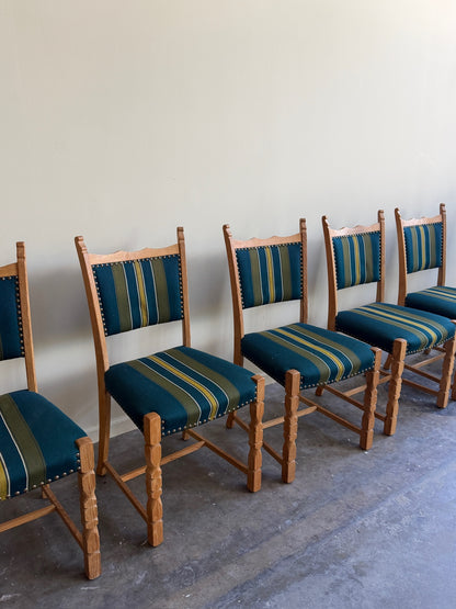 Henning Kjaernulf oak upholstered dining chairs. Sold in pairs.