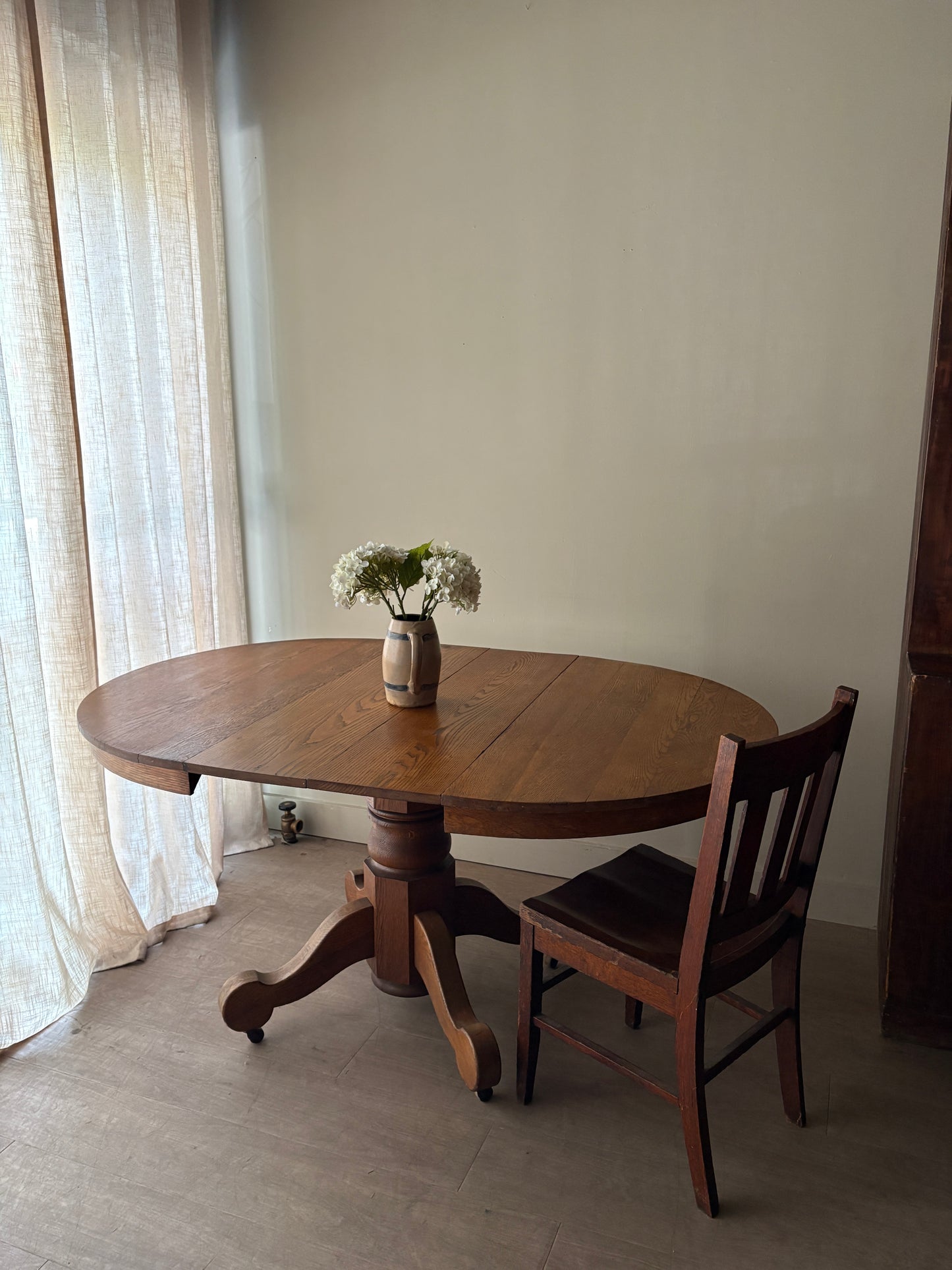 Oak dining table with extensions