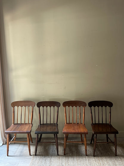 Scalloped mixed wood dining chairs. Sold in pairs.