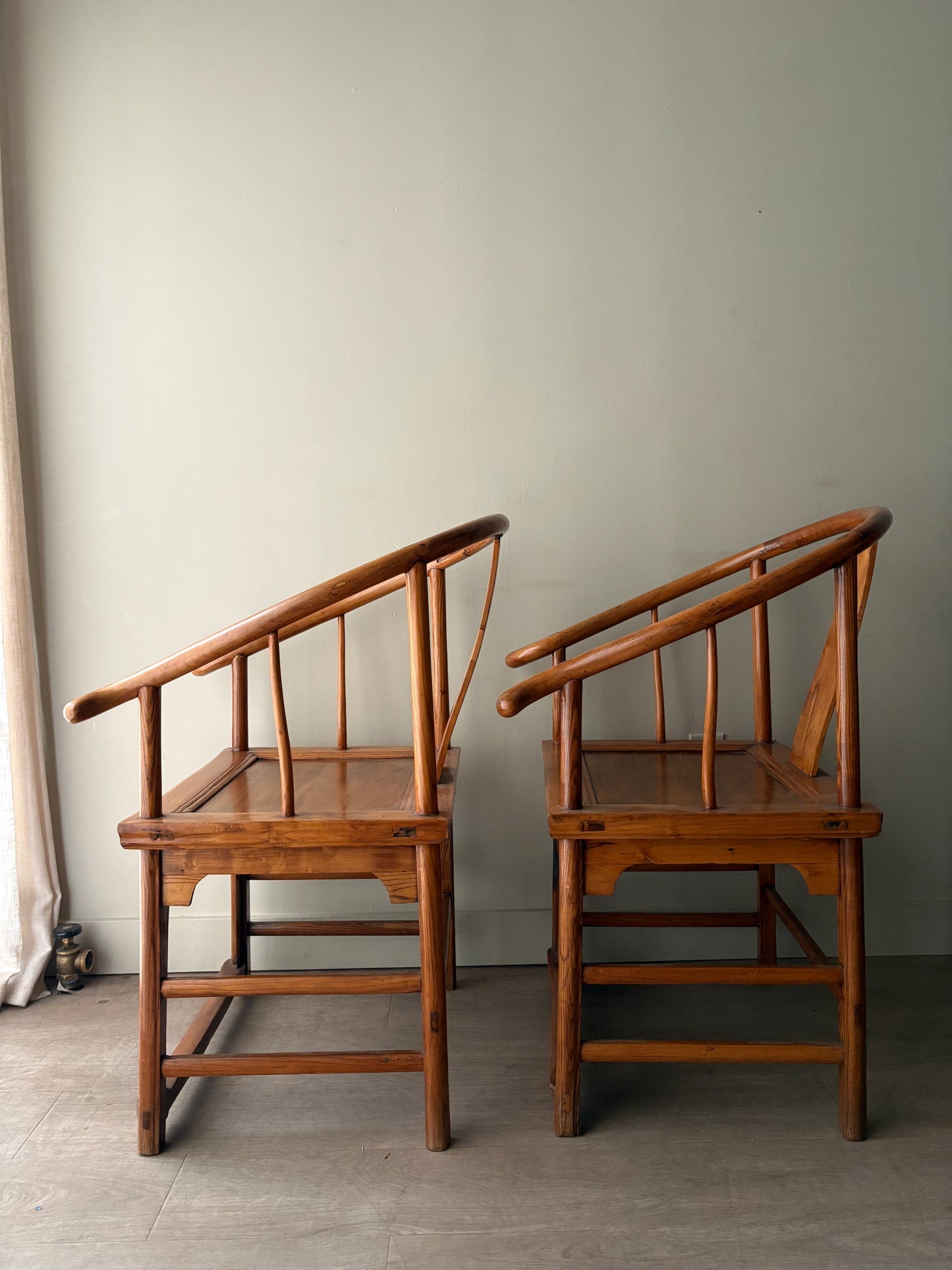 Chinese elmwood yoke back armchairs. Sold individually