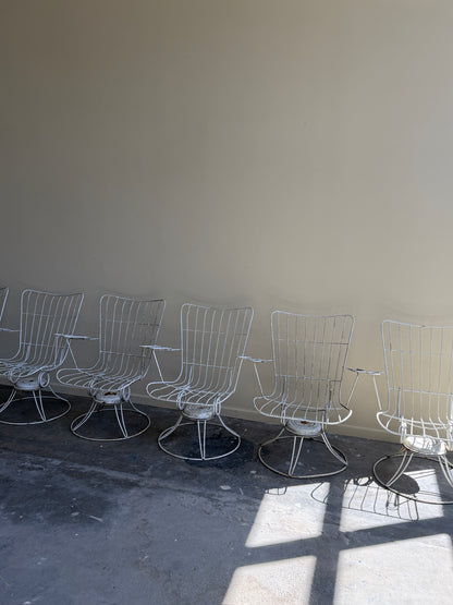 White swivel patio chairs. Sold individually.
