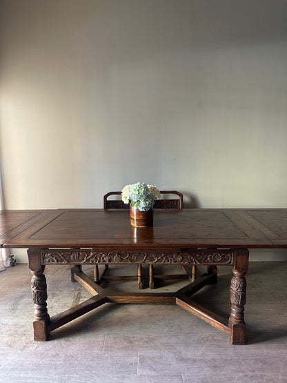 Oak Tudor revival dining table with extensions