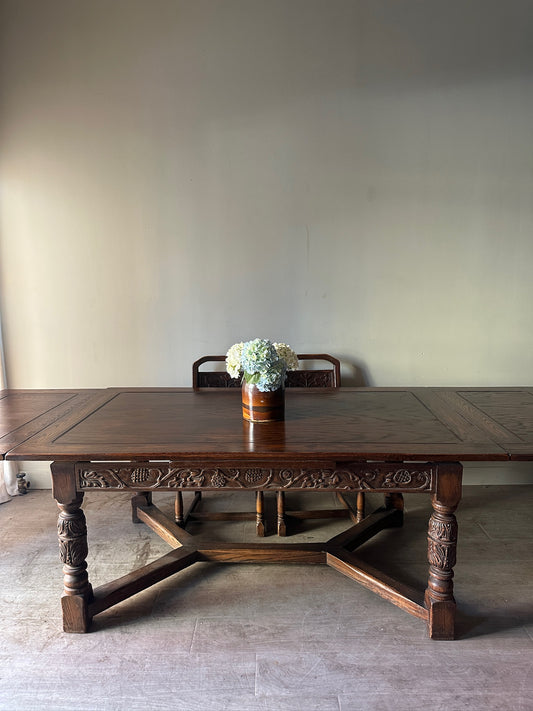 Oak Tudor revival dining table with extensions