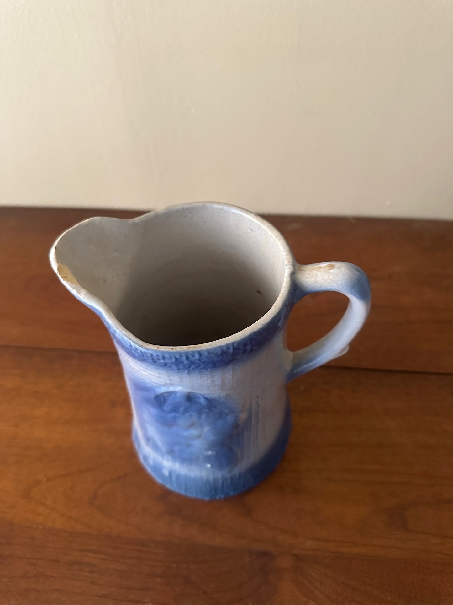 Salt glazed stoneware pitcher with fruit