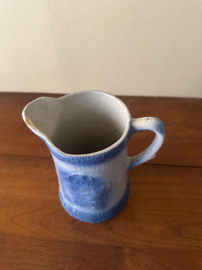 Salt glazed stoneware pitcher with fruit