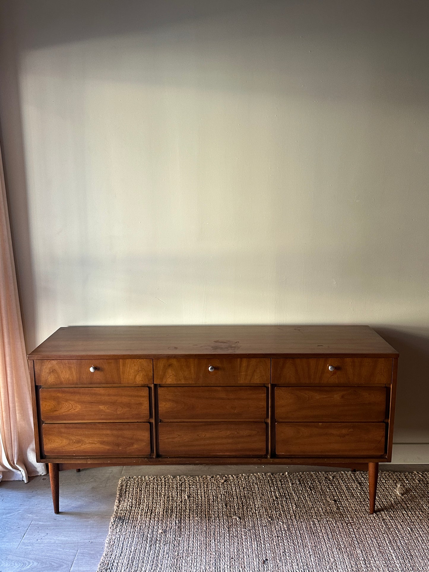 Walnut nine drawer, chrome knob dresser