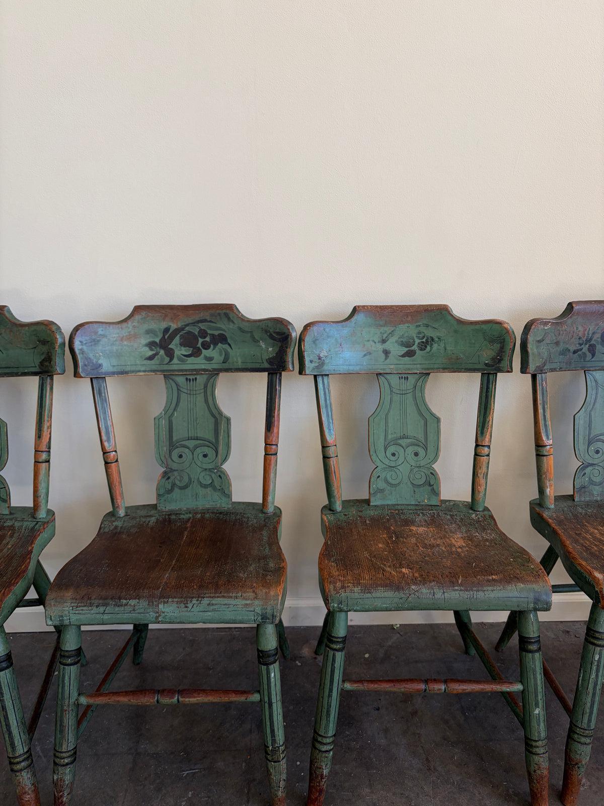 Pennsylvania Sheraton Paint-Decorated Plank Seat Chairs. Sold in pairs.