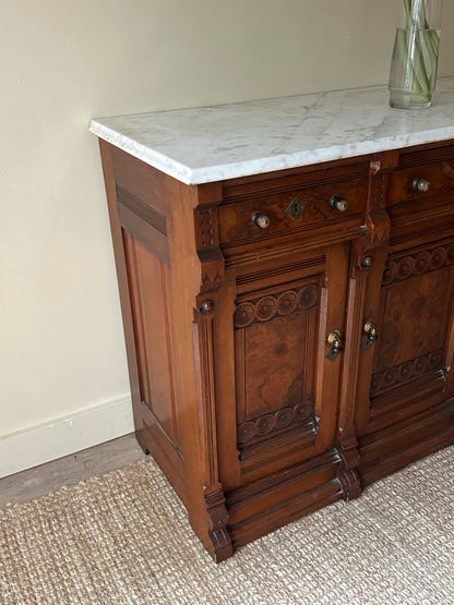 Carved walnut marble top sideboard